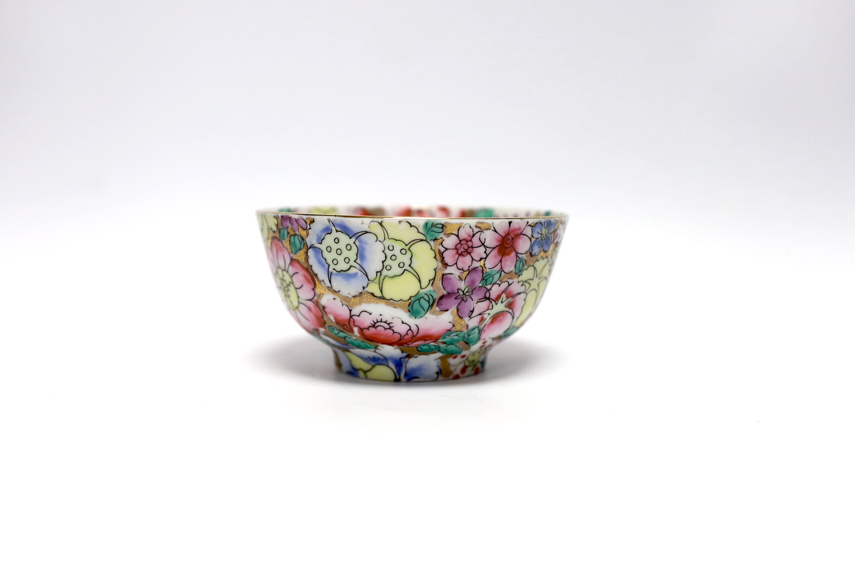 A small circular Chinese porcelain bowl having polychrome 'millefiore' and gilt decoration, diameter 11.5cm, red seal mark to base